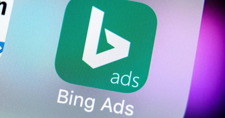 Close-up of the Bing Ads app icon with a green background and white logo on a digital screen.